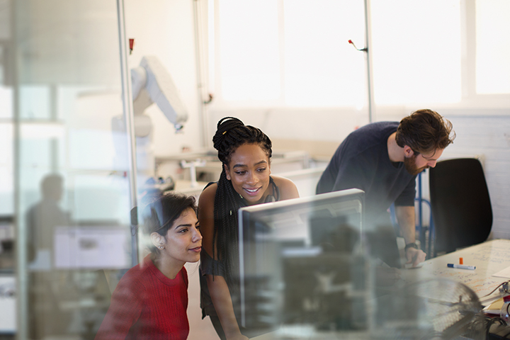 group of engineers working together in an office