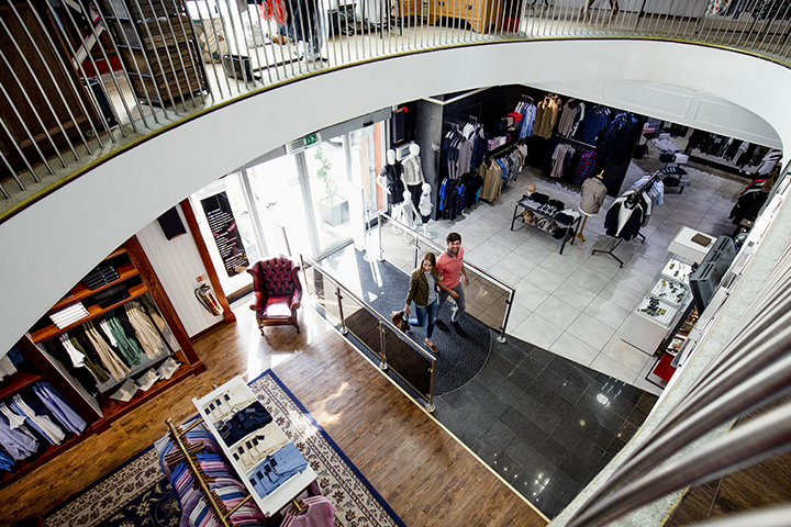 viewed from above with railings of the second floor seen framing the image