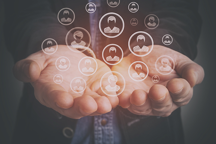 Hands cupped together and holding customer icons