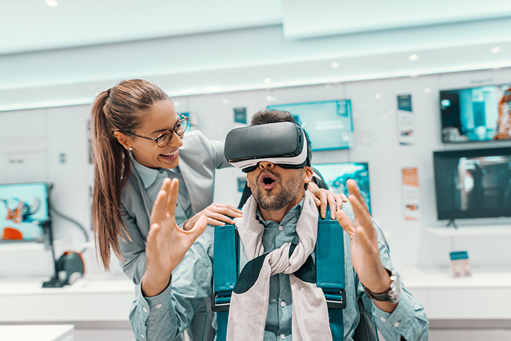 Person in store using VR headset with amazed facial expression