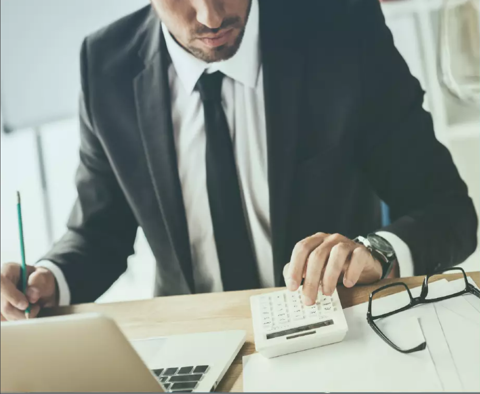 Man using a calculator