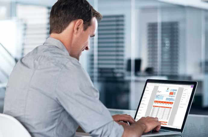 a man working on a laptop back view