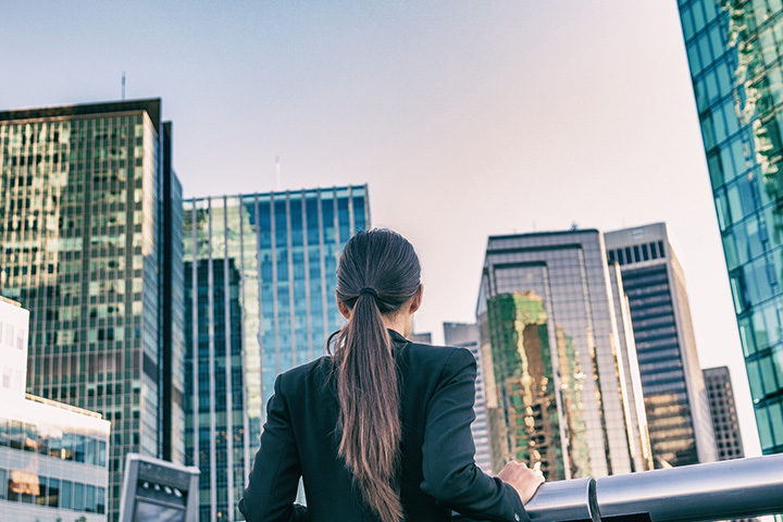 real estate broker overlooking city