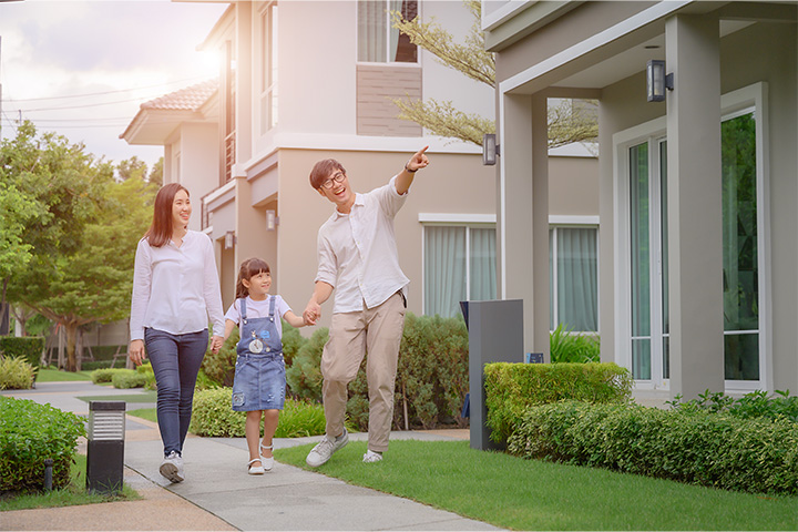 family walking along nice residential complex