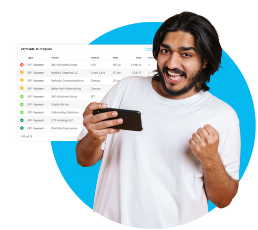 a guy with his phone and ap automation dashboard at the background