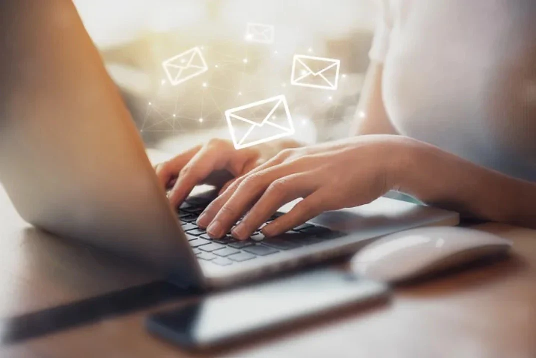 woman typing on laptop
