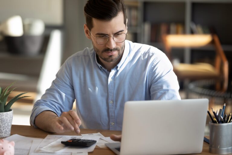 businessman working with laptop and calculator