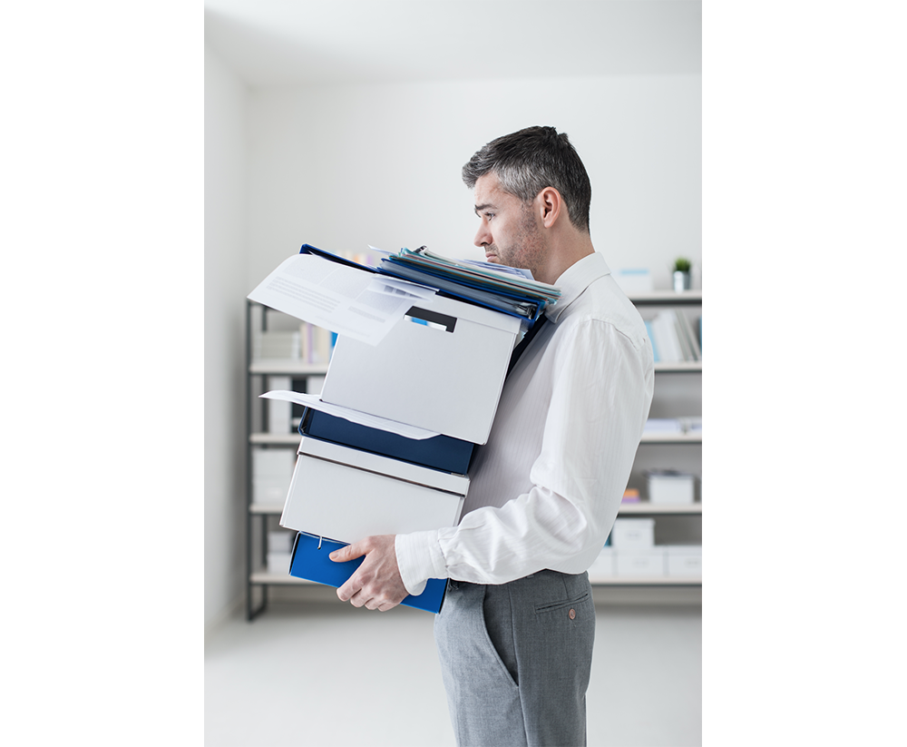 Man holding boxes of files