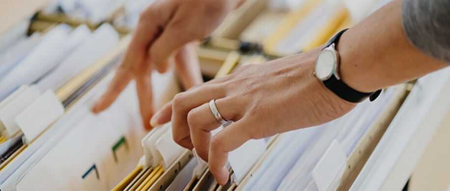 hands searching for file