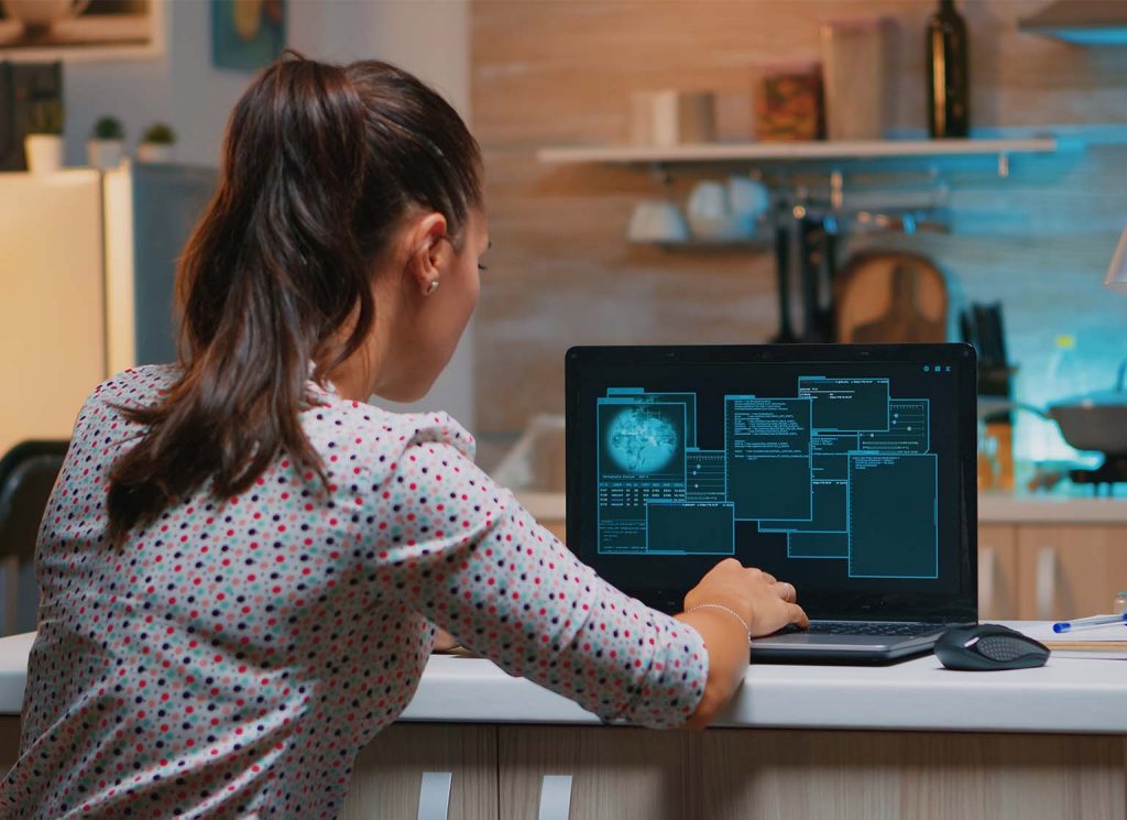 woman hacker working at home with a laptop