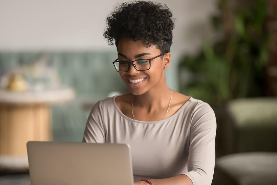 woman working with laptop smiling