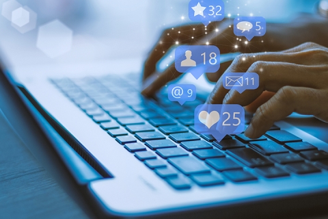 woman using laptop and social media