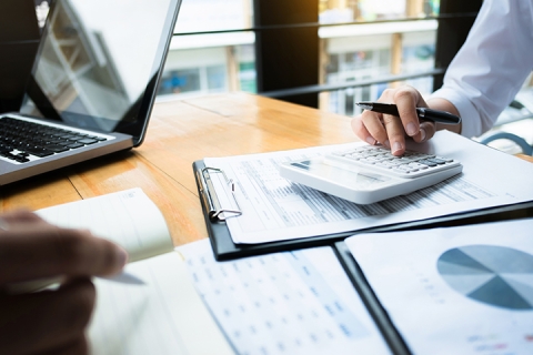 people in an office working on a finance related task