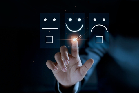 Finger of businessman touching and check mark icon face emoticon smile on dark background