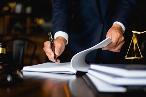 lawyer businessman working or reading lawbook in office workplace