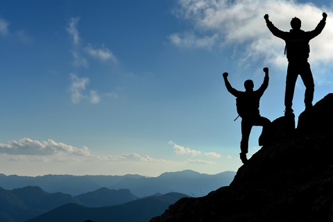 two climbers overcoming tough mountain challenge