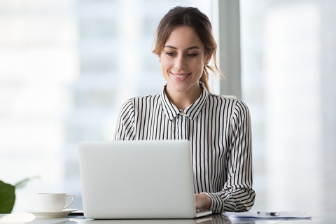 businesswoman professional worker working online doing job on laptop at desk