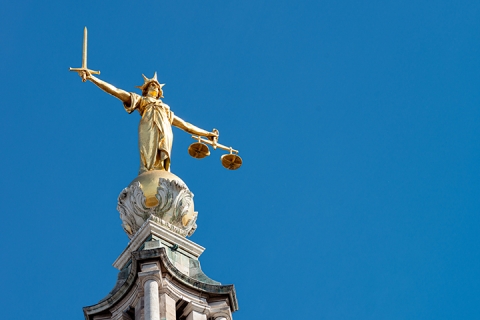 Central Criminal Court with a statue of Lady Justice holding a sword and balancing scale
