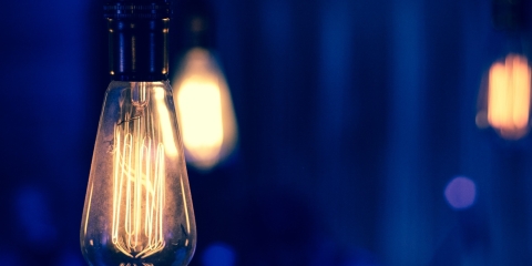 Edison lightbulbs hanging in the dark night