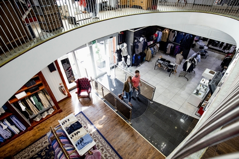 viewed from above with railings of the second floor seen framing the image
