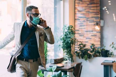 Businessman with mask is going to work during COVID-19 pandemic