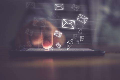 Man hand using phone with email icon emerging and digital mail concept