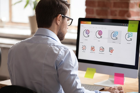 man at computer with Inspire software displayed on screen