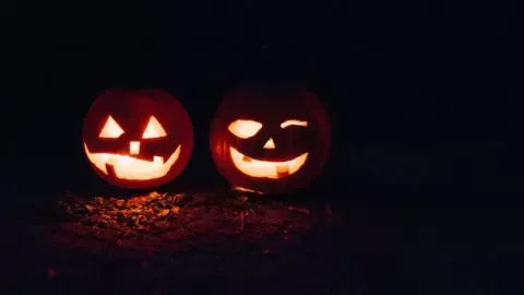 Jack-o-lanterns glowing in the night