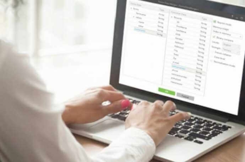 fingers typing on keyboard