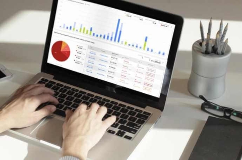 a laptop showing financial software