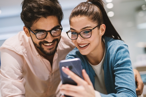 Happy couple with mobile