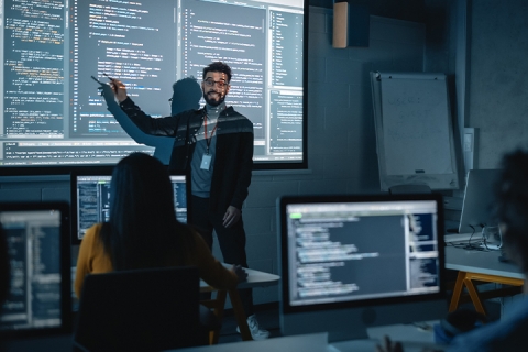 man hosting software training class