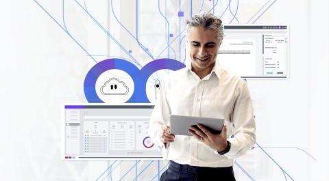 Man on iPad against abstract background of branching upward lines 