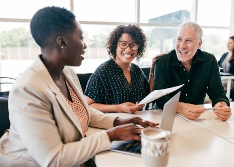 Older man and younger woman receiving consultation