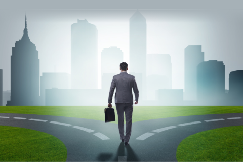 businessman standing at a crossroads, making a difficult decision