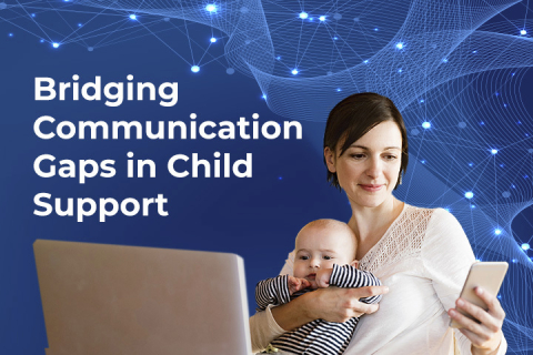 smiling mother looking at mobile phone with baby on her lap