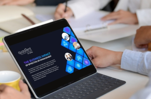 A laptop displaying Quadient product presentation