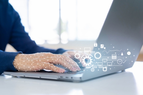 person typing on laptop