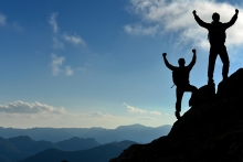 two climbers overcoming tough mountain challenge