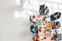 group of business coworkers in team meeting discussion, top view modern office with copy space. Partnership professional teamwork, startup company, or project brainstorm concept