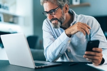 businessman working at home using lap top and smart phone