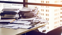 Pile of documents and papers on a desk