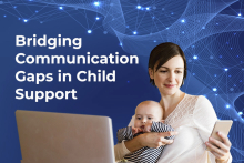 smiling mother looking at mobile phone with baby on her lap